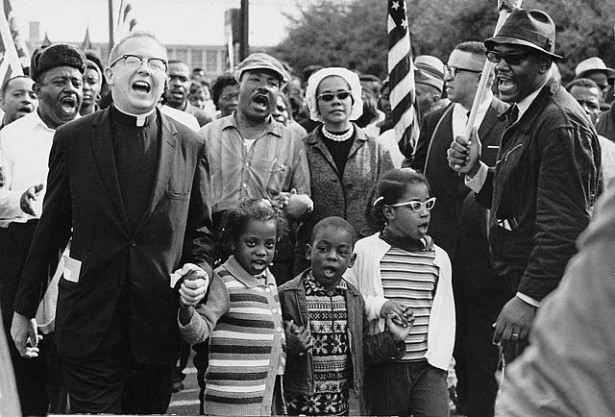 The Selma to Montgomery marchers arrive in Montgomery. At center are Martin Luther and Coretta Scott King, with Ralph Abernathy’s three children. (Wikipedia / Abernathy Family Photos)